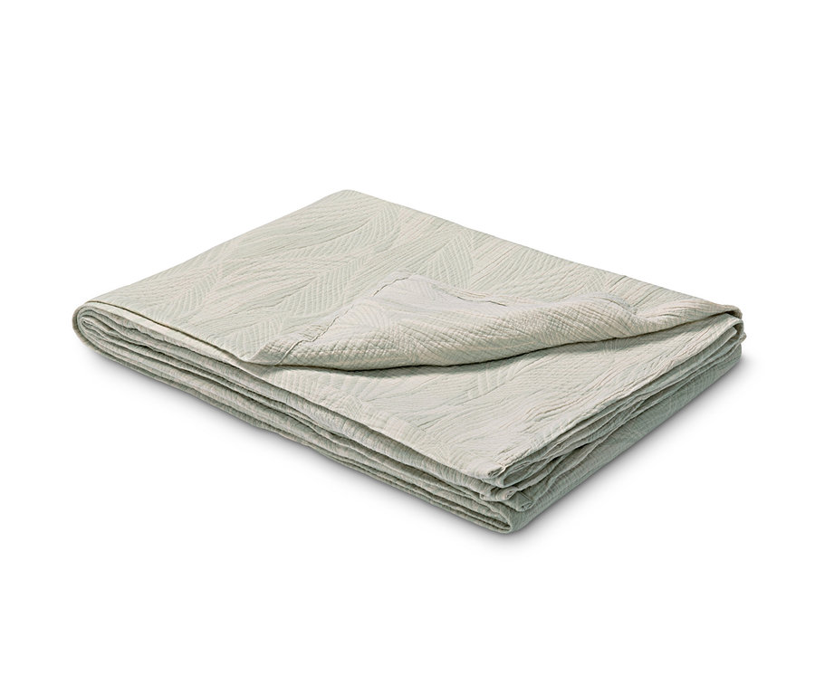 Összehajtott, texturált Jacquard takaró, világosszürke.