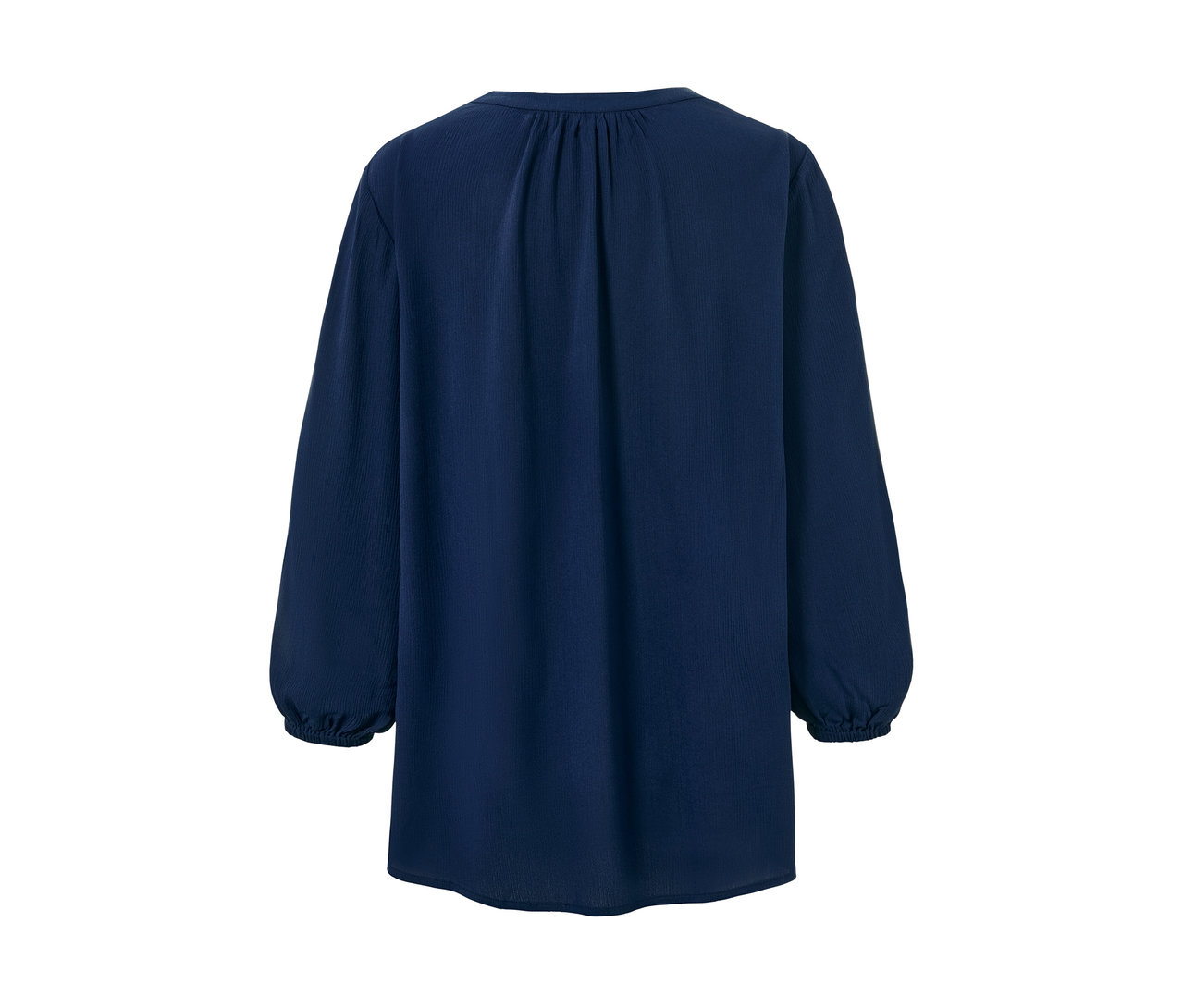 Egy kék, hosszú ujjú tunikablúz.