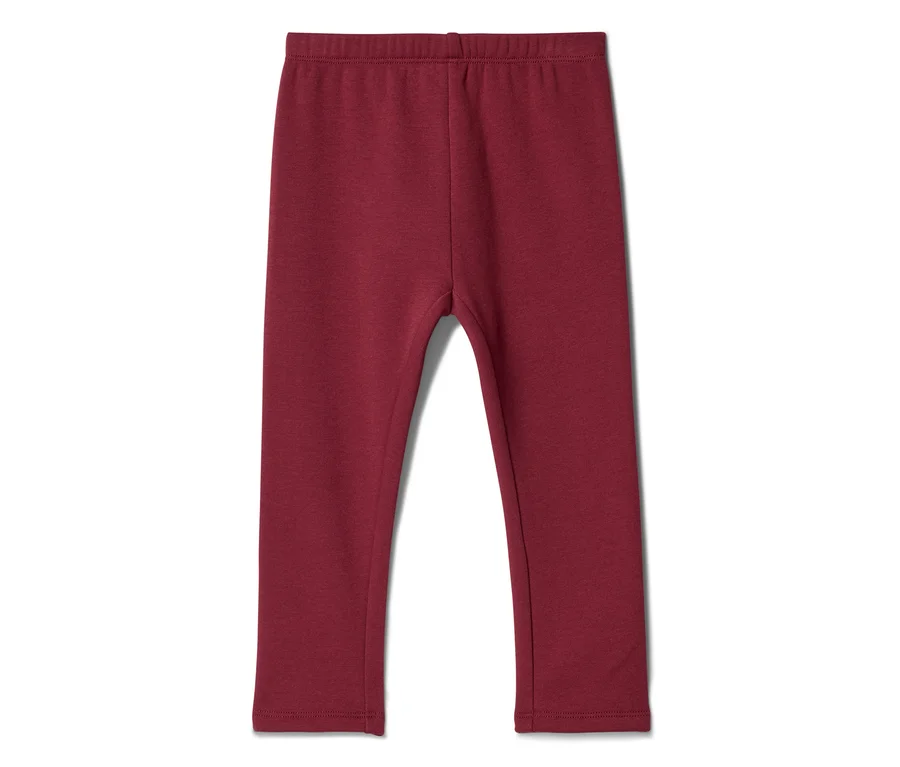 Sötétvörös gyerek leggings, laposan fekszik fehér háttéren.