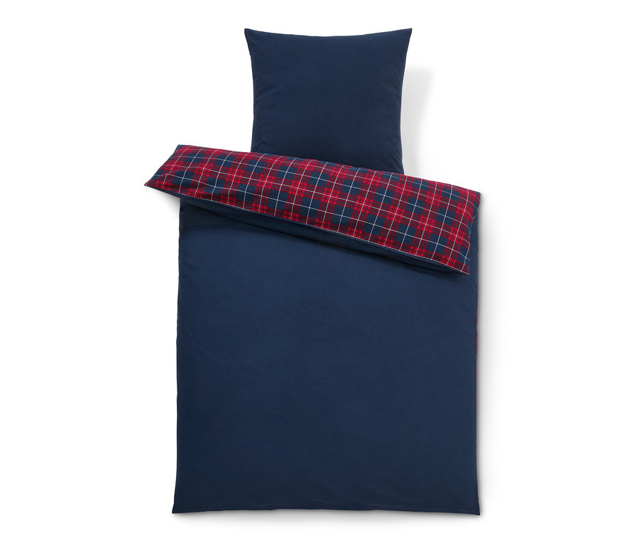 Kék pamutflanel ágynemű normál méretben, kockás párnával.