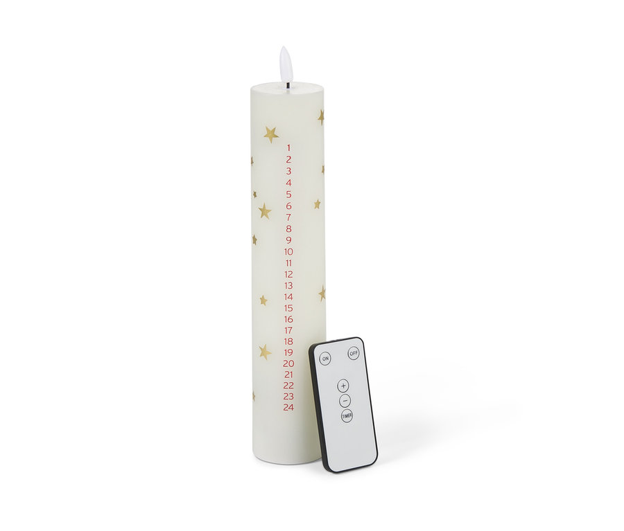 Egy LED-es viaszgyertya adventi naptárral, arany csillagokkal és távirányítóval.