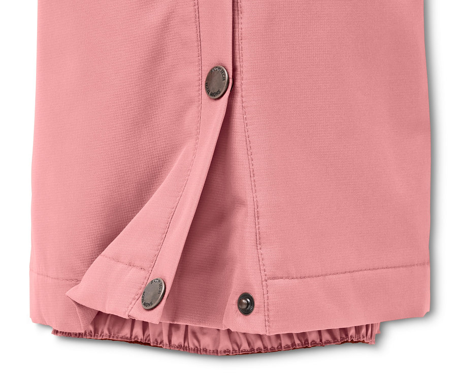 Rózsaszín női sí- és snowboard nadrág részlete patentos zárással.