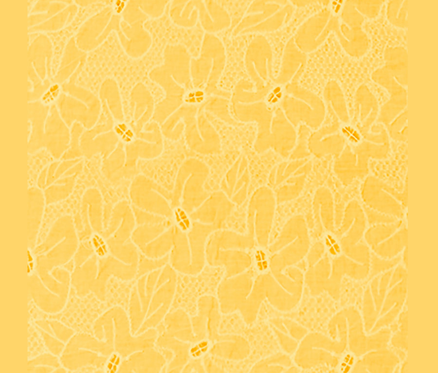 Egy sárga, hímzett pólóblúz részlete.