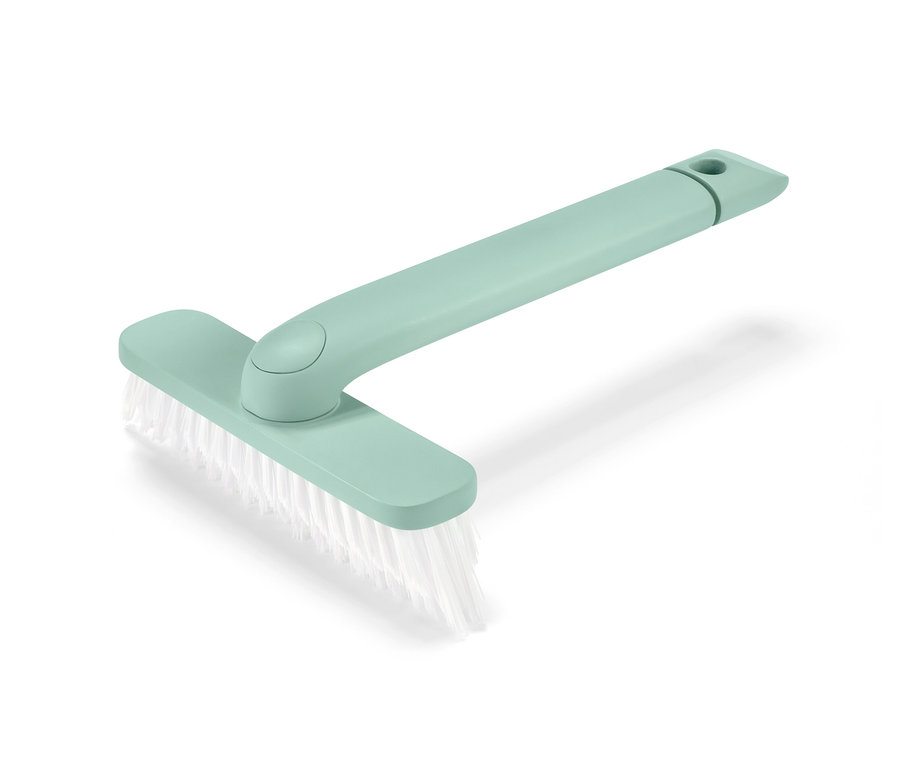 Egy zöld 4 az 1-ben praktikus fugatisztító kefe fehér sörtékkel, fehér háttérrel.