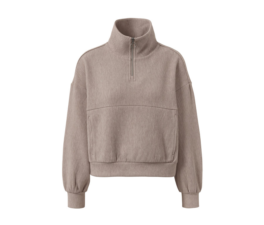 Bézs színű szabadidőfelső rövid cipzárral és bordázott textúrával.