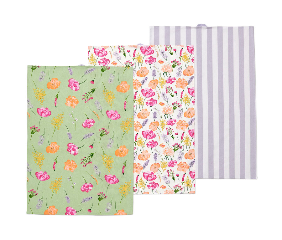Három konyharuha: egy zöld virágmintás, egy virágos és egy fehér lila csíkos.