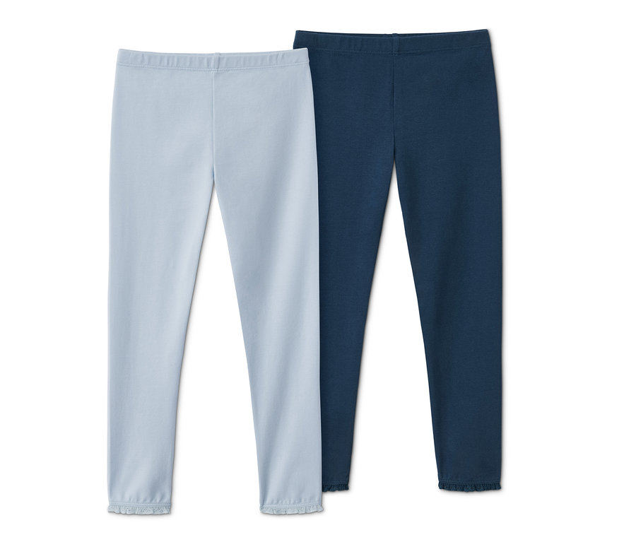 Két világoskék és sötétkék leggings szettben.