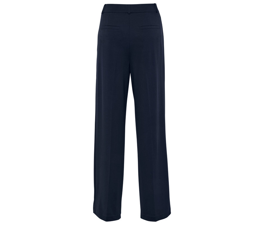 Hátulnézet egy sötétkék, bő szárú nadrágról.