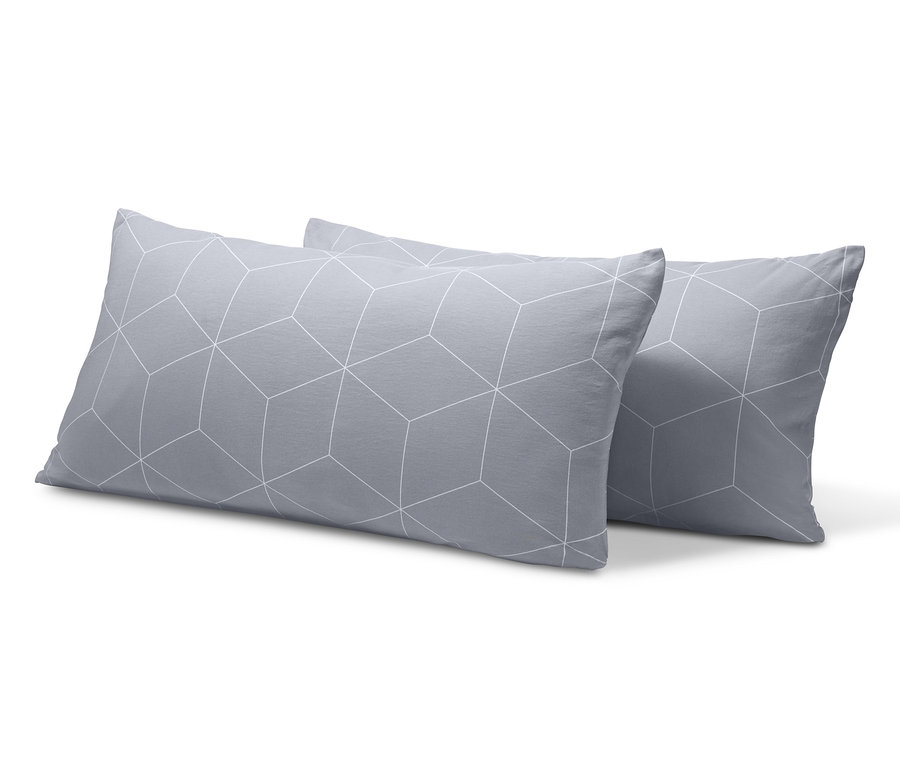 Két szürke, geometrikus mintás jersey párnahuzat.