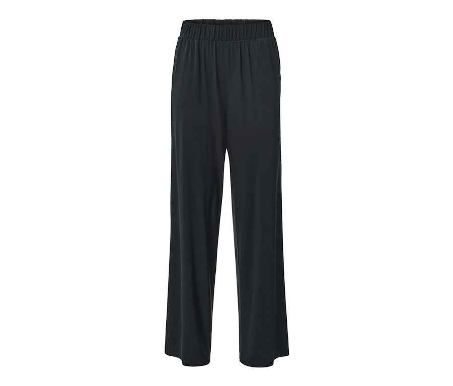 Egy fekete palazzo nadrág látható fehér háttér előtt.