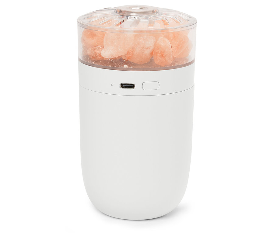 Fehér lámpa rózsaszín sókristályokkal egy átlátszó tetőben.