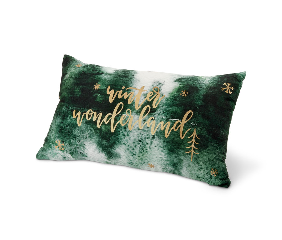 Egy zöld-fehér téli mintás díszpárna.