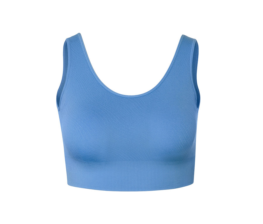 Egy kék női seamless bustier sportmelltartó részlete.