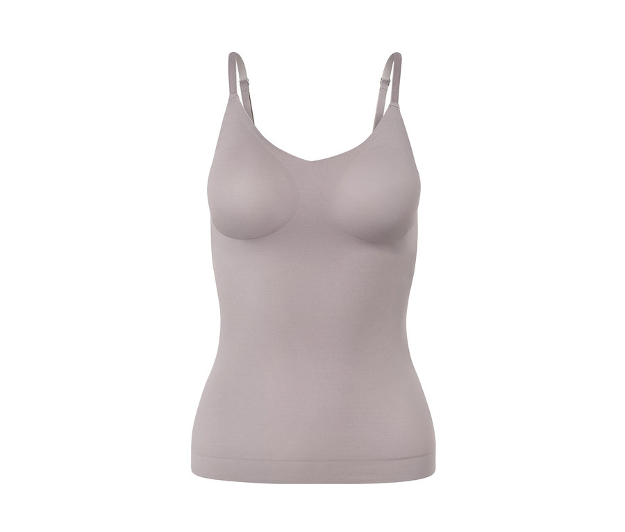 Egy bézs színű női komfort trikó, szürke, fehér alapon.