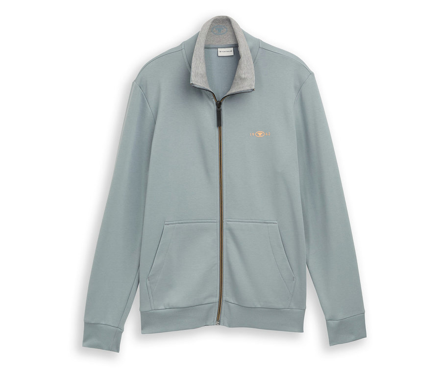 Világoszöld, állógalléros, cipzáras Tom Tailor szabadidőfelső. Két zsebe és egy kis logója van.