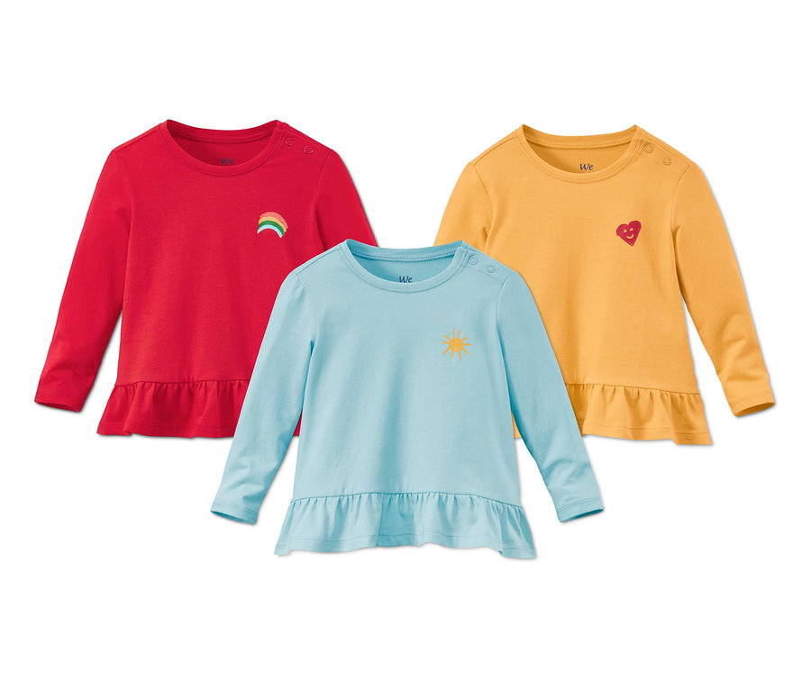 Három bio pamut felső: piros szivárvánnyal, sárga szívvel és világoskék napocskával.