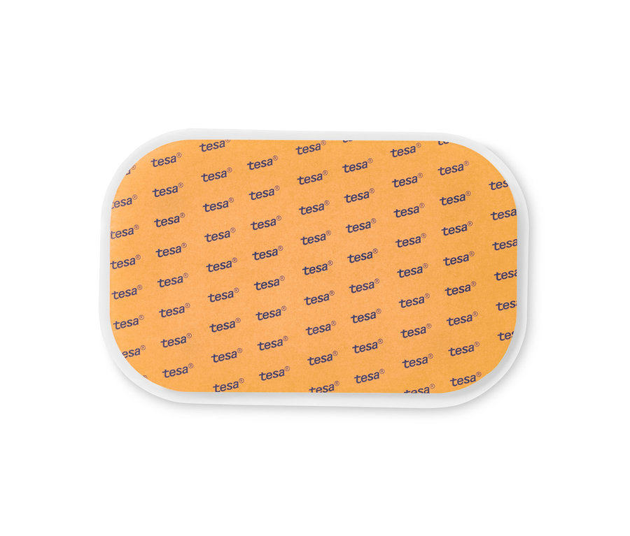 Narancssárga csúszásgátló szőnyegalátét ismétlődő Tesa logó mintával.