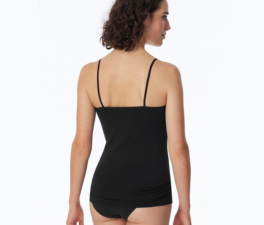 Hátulról látható egy nő fekete SCHIESSER toppban.