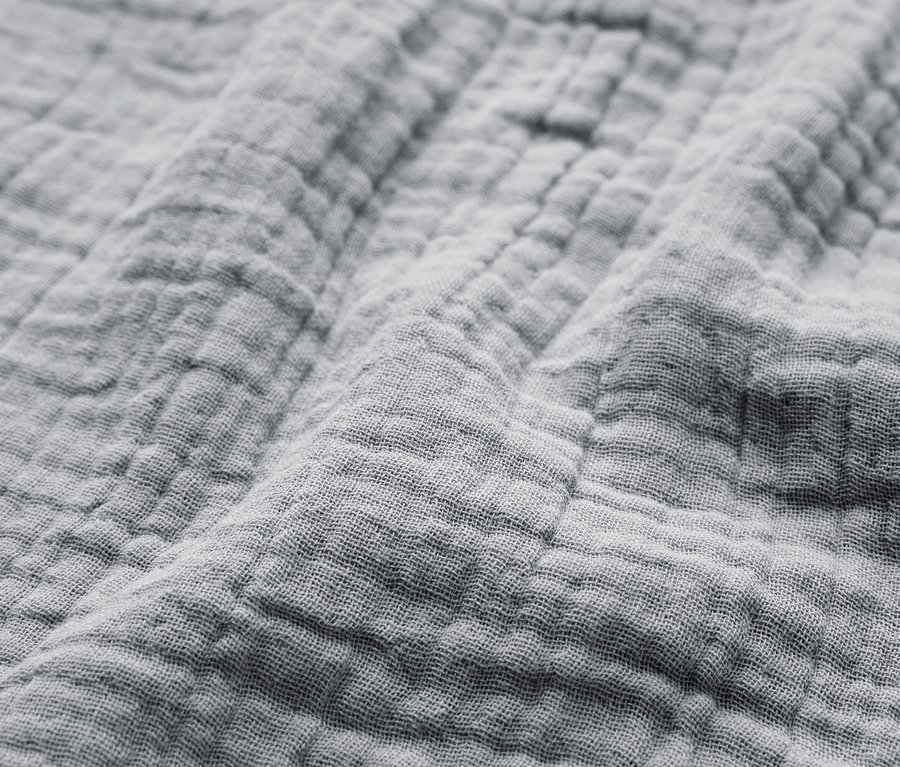 Egy szürke, texturált anyag közeli képe