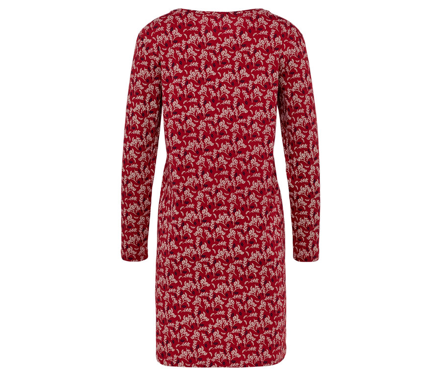 Hátulnézet egy piros, hosszú ujjú, virágmintás ruháról.