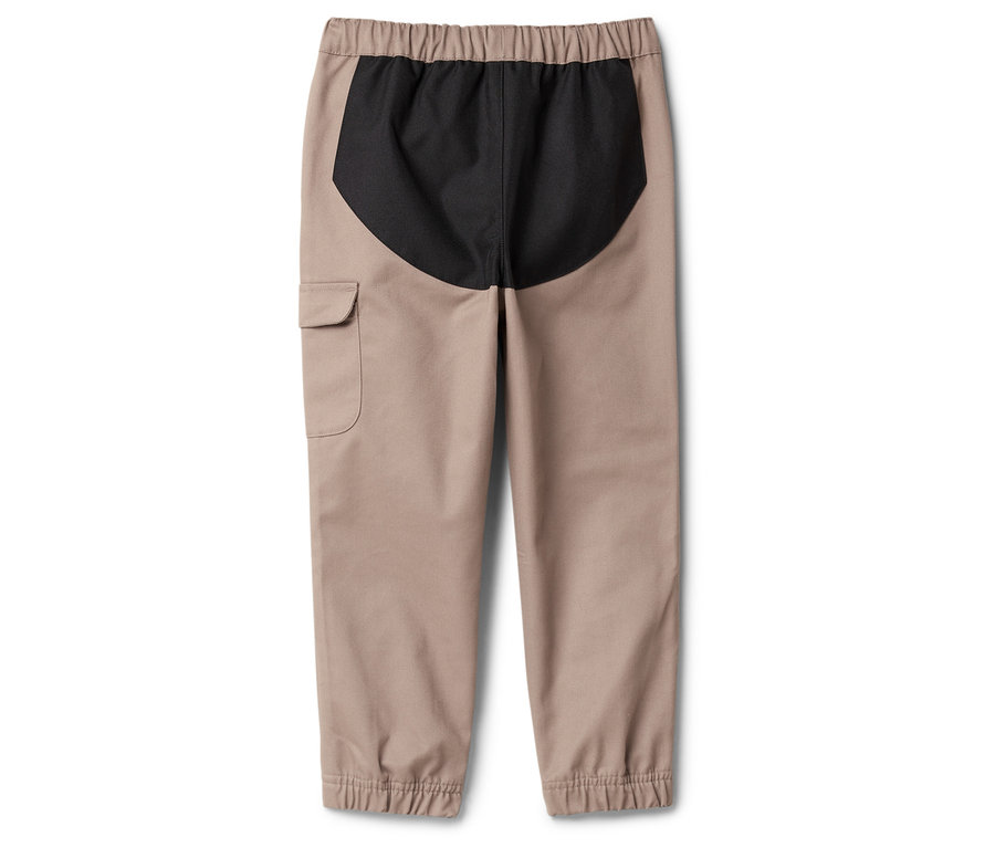 Bézs színű nadrág elasztikus derékpánttal és fekete betéttel a hátulján.