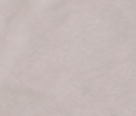 Egy bézs színű műszőrme takaró közeli képe.