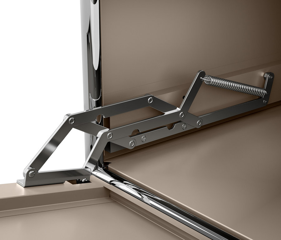 Közelkép egy szürkésbarna fém CN3 komódra, lenyíló ajtókkal és nyitószerkezettel.