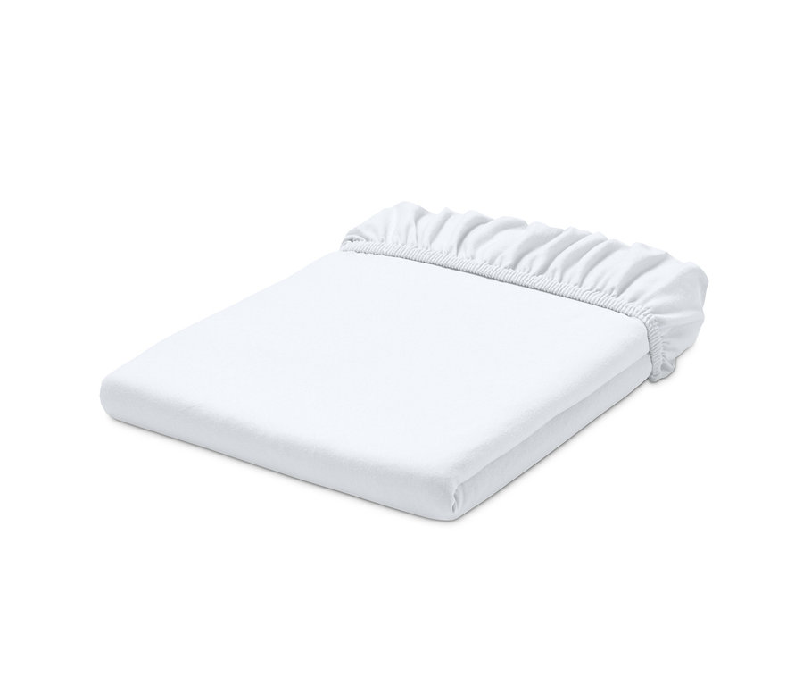 Egy fehér jersey gumis lepedő összehajtva.