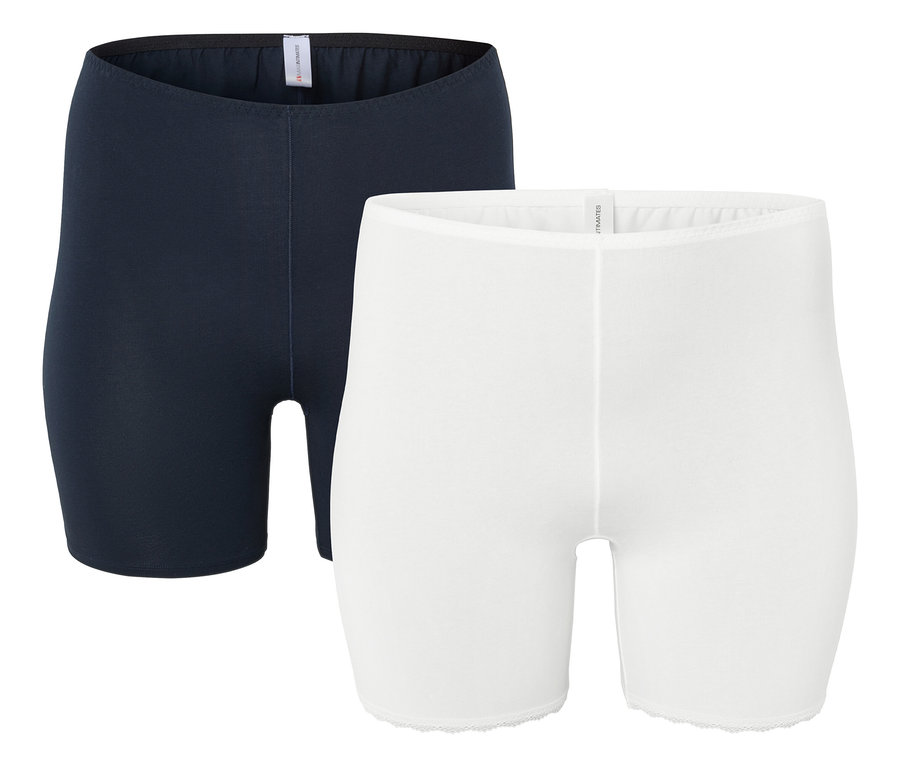 Két rövid női nadrág: egy sötétkék és egy fehér.