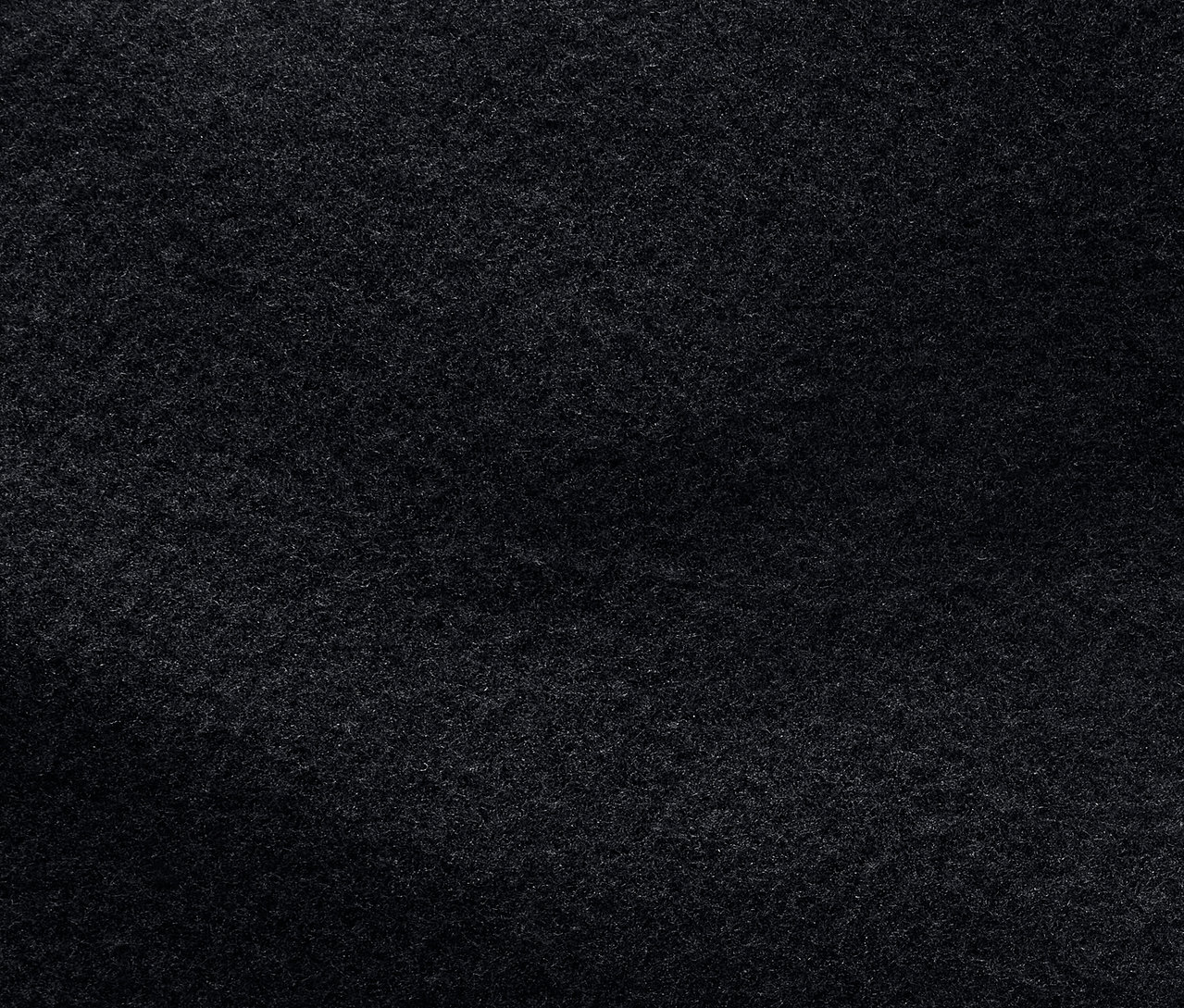 Egy sötétszürke szövet textúrájának közeli felvétele.