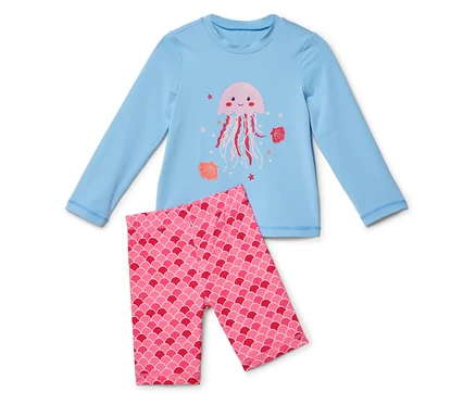 Egy világoskék, hosszú ujjú felső rózsaszín medúzával és rózsaszín, pikkelymintás leggings.