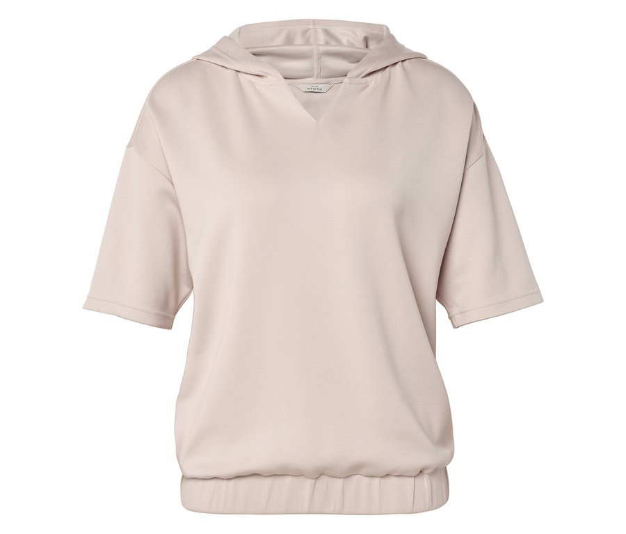 A képen egy bézs, rövid ujjú kapucnis pulóver látható.