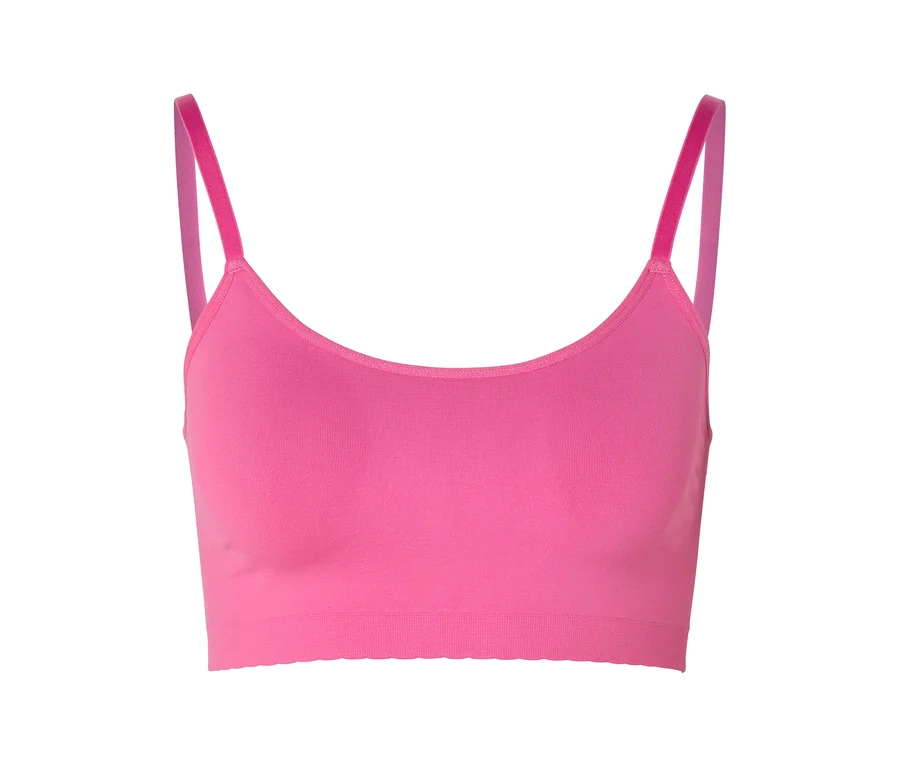 Rózsaszín, seamless bustier melltartó csipkével és vékony pántokkal, fehér háttér előtt.