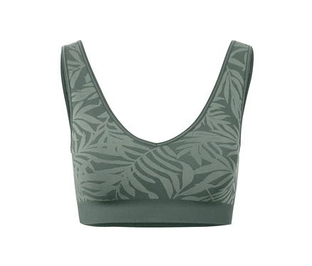 Egy zöld, levélmintás, női seamless bustier sportmelltartó részletfotója.