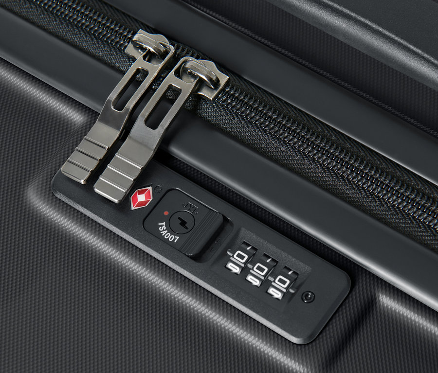 Nagy méretű kemény bőrönd részlete TSA kombinációs zárral.