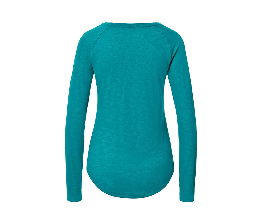 Türkiz női hosszú ujjú sportfelső részlete.