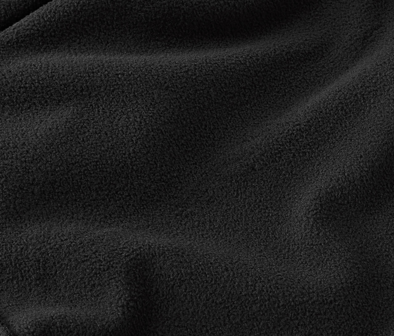 Közelkép egy fekete polár anyag textúrájáról.