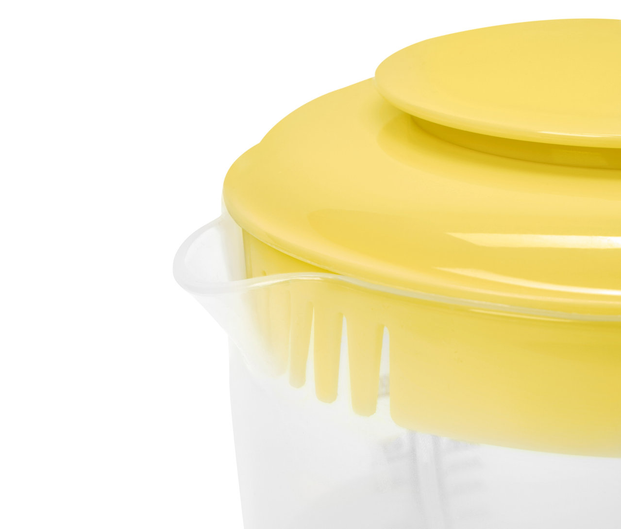 Sárga fedő egy átlátszó mérőedényen.