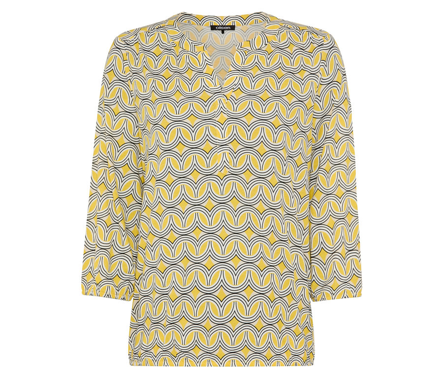 Geometrikus mintás sárga blúz.
