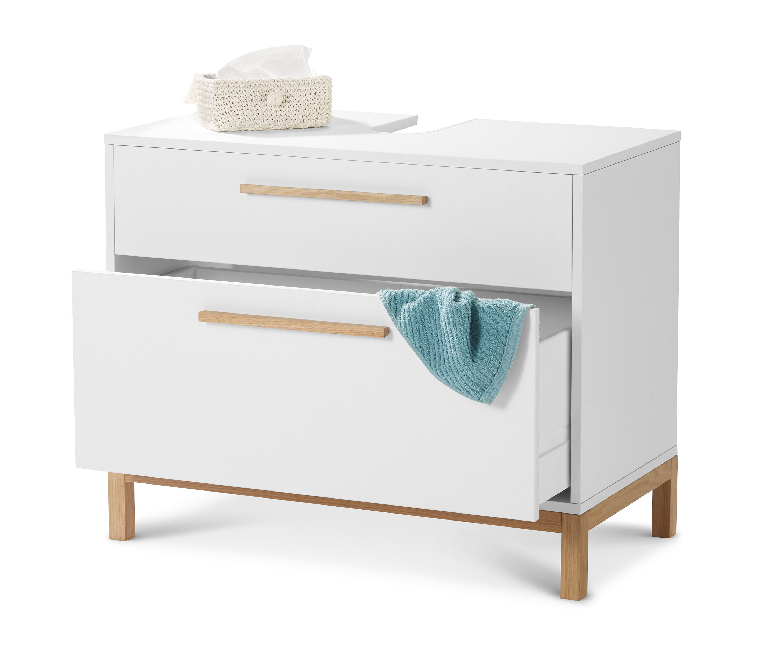 Fehér mosdó alatti szekrény »Eklund« 2 fiókkal, az egyik fiók nyitva van, benne egy kék törölközővel. A tetején egy doboz papír zsebkendő található.