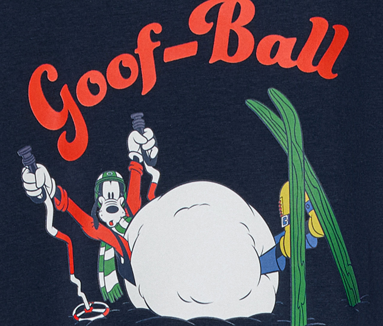 Goofy rajzfilmfigura sífelszereléssel havas jelenetben, "Goof-Ball" felirattal.