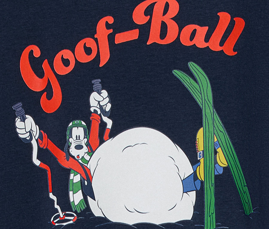 Goofy rajzfilmfigura sífelszereléssel havas jelenetben, "Goof-Ball" felirattal.