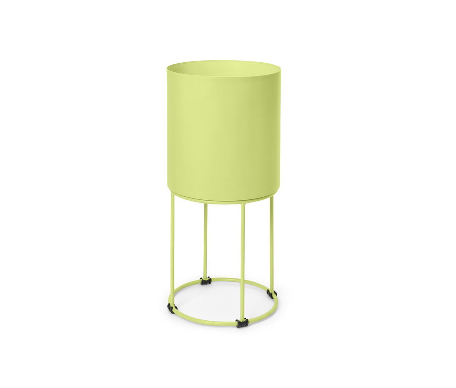 Zöld, kerek virágtartó állványon.