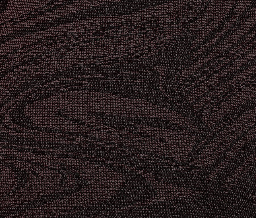 Közeli kép egy mintás, sötétbarna női seamless sportnadrágról.