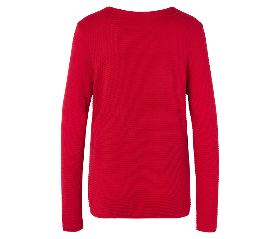 Piros, hosszú ujjú pulóver.