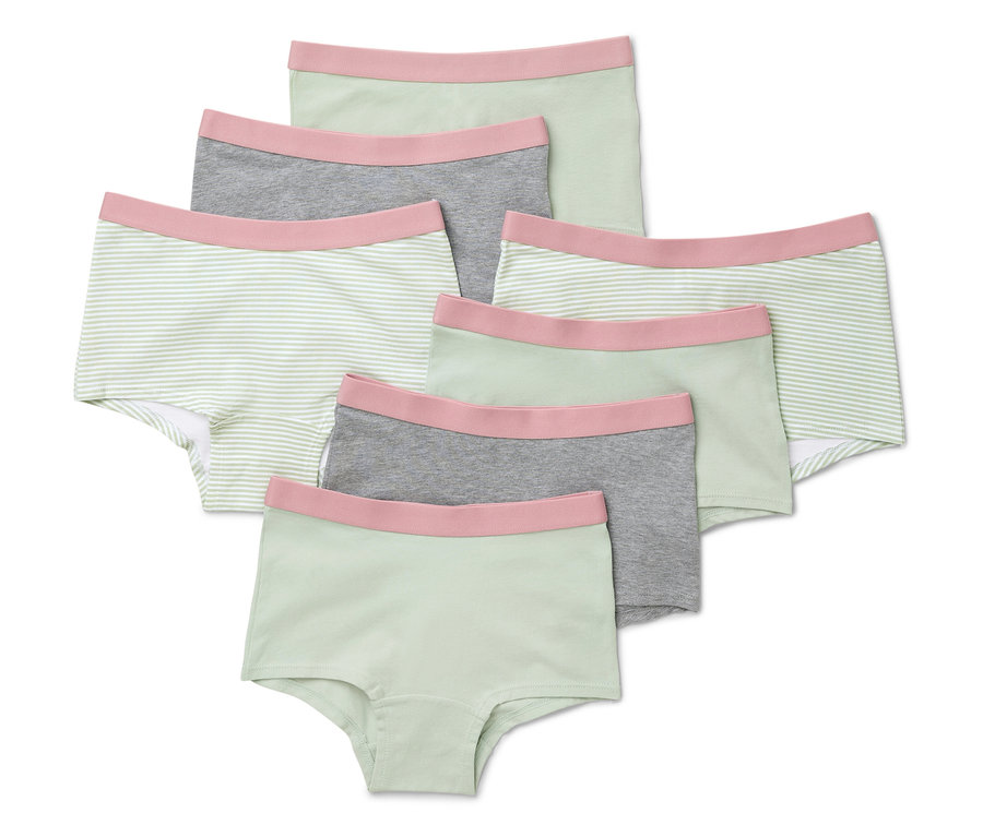 Hét mentazöld lány bugyi fekszik egymáson.