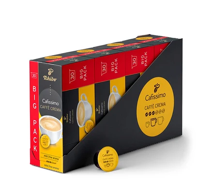 Egy csomag 120 db Caffè Crema mild kávékapszula fekete, piros és sárga csomagolásban. Egy kapszula a csomag előtt fekszik.