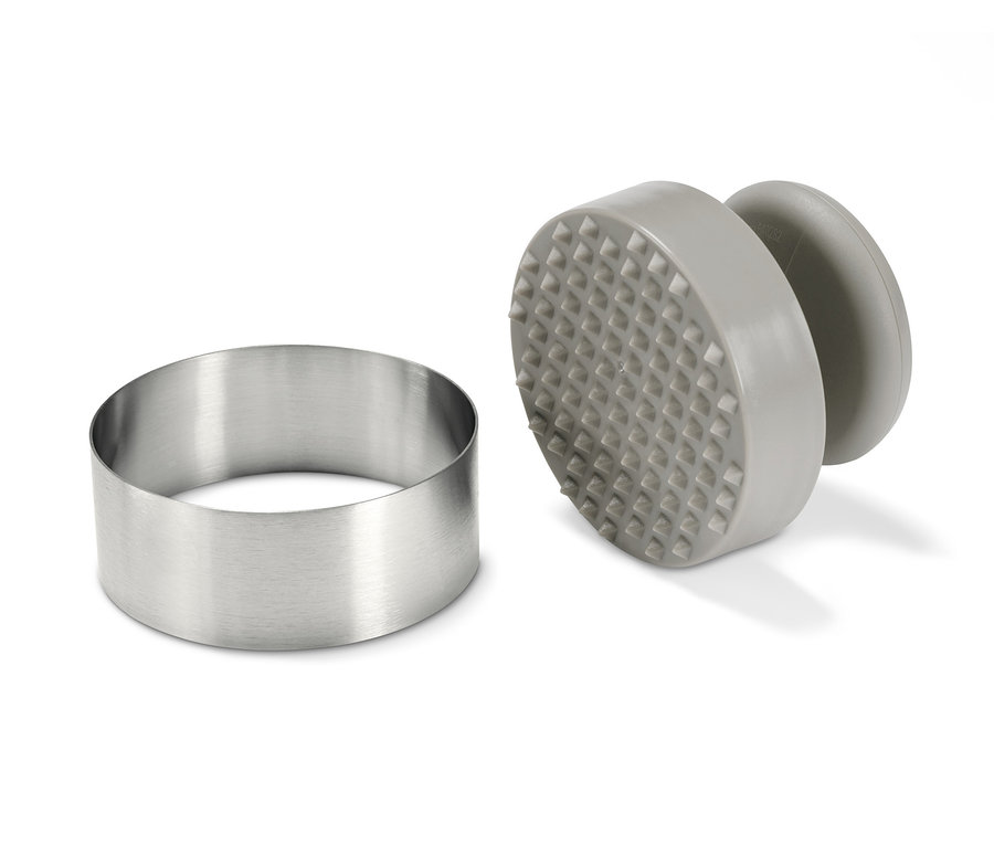 Egy rozsdamentes acél gyűrű és egy szürke hamburger prés.