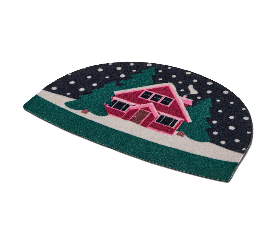 Lábtörlő, havas ház motívummal, fák között.