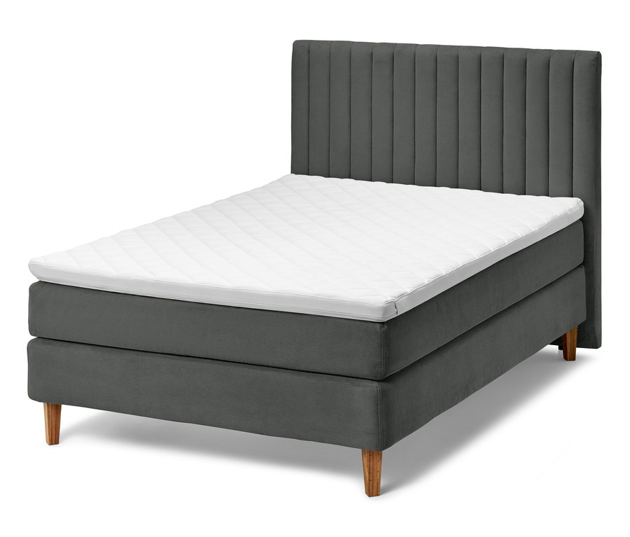 Antracit boxspring ágy fejvéggel és fehér fedőmatraccal.
